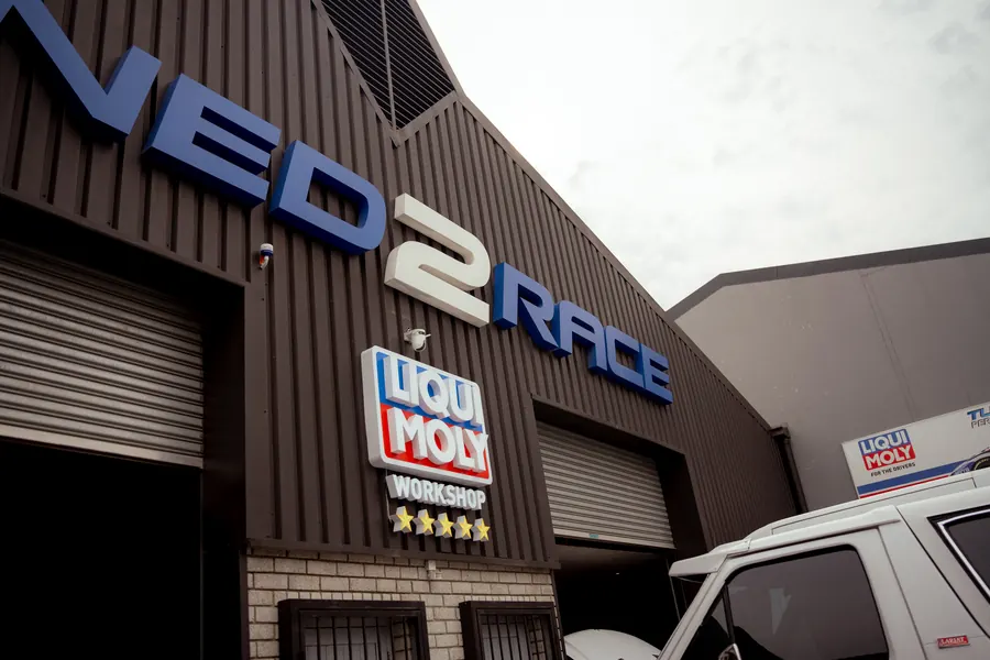 The Liqui Moly five-star workshop sign on the Tuned 2 Race building