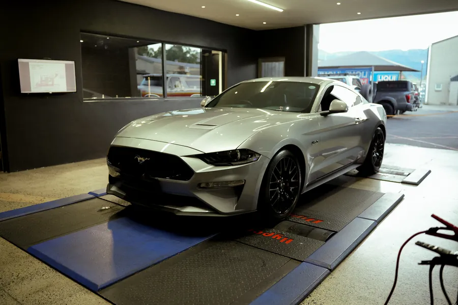 Ford Mustang GT strapped down on the Tuned 2 Race dyno