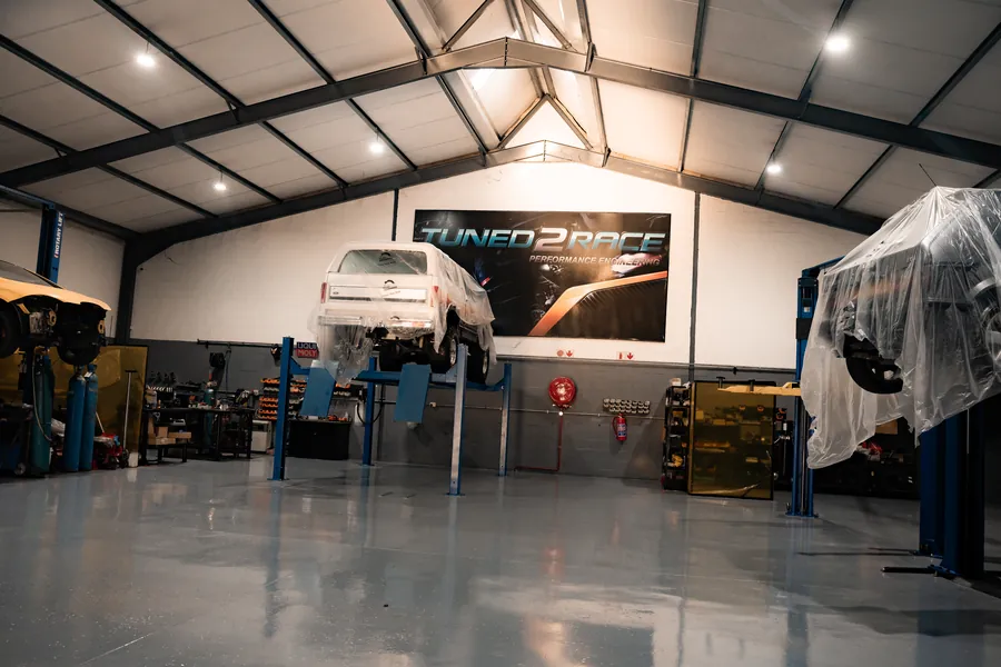 Wide view of the workshop under the Tuned2Race banner